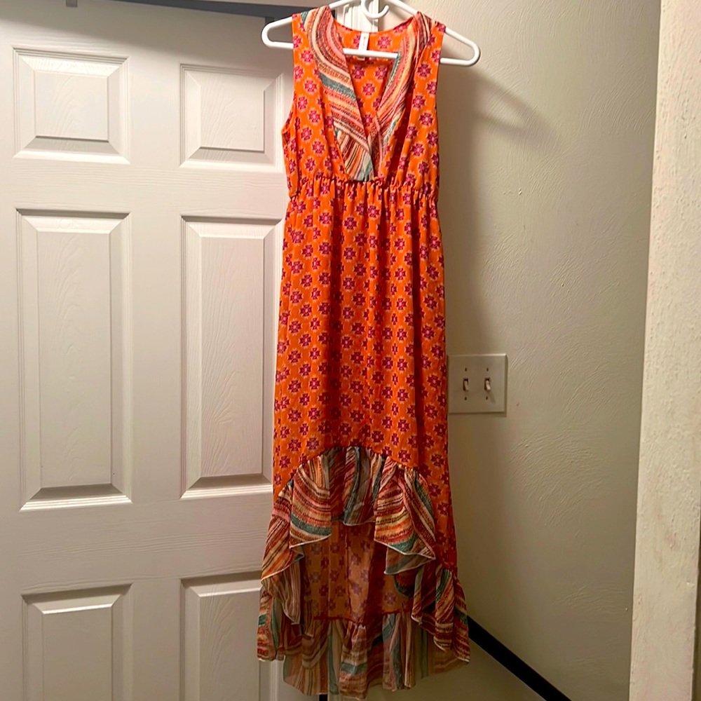 NWOT never worn. Small snag can barely see photoed. Comes with attached slip.